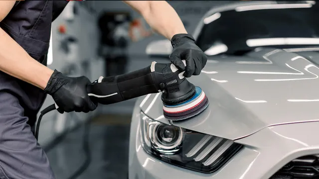 Machine polishing the front of a white Mustang