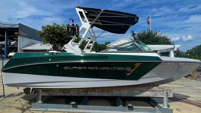Green Super Air Nautique on a lift after a marine detail